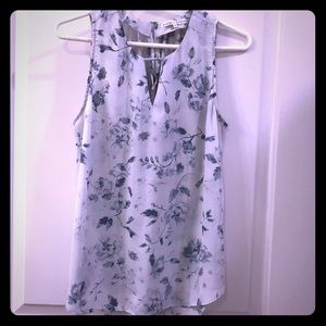 Blue and white sleeveless blouse